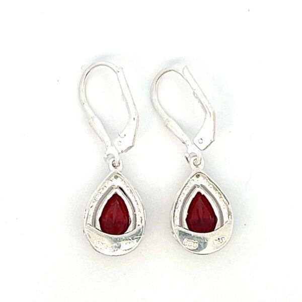 One estate pair of sterling silver drop earrings with pear-shaped faceted garnets and textured silver halos