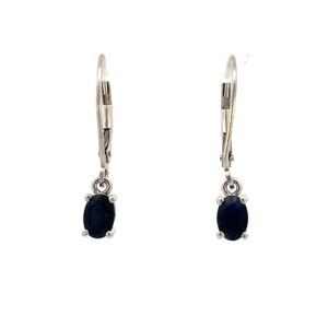 One estate pair of sterling silver drop earrings with 2 oval-shaped faceted dark blue sapphires and leverback closures