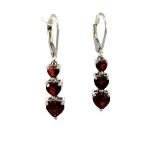 One estate pair of sterling silver graduated drop earrings with each earring set with 3 faceted heart-shaped garnets with leverback closures
