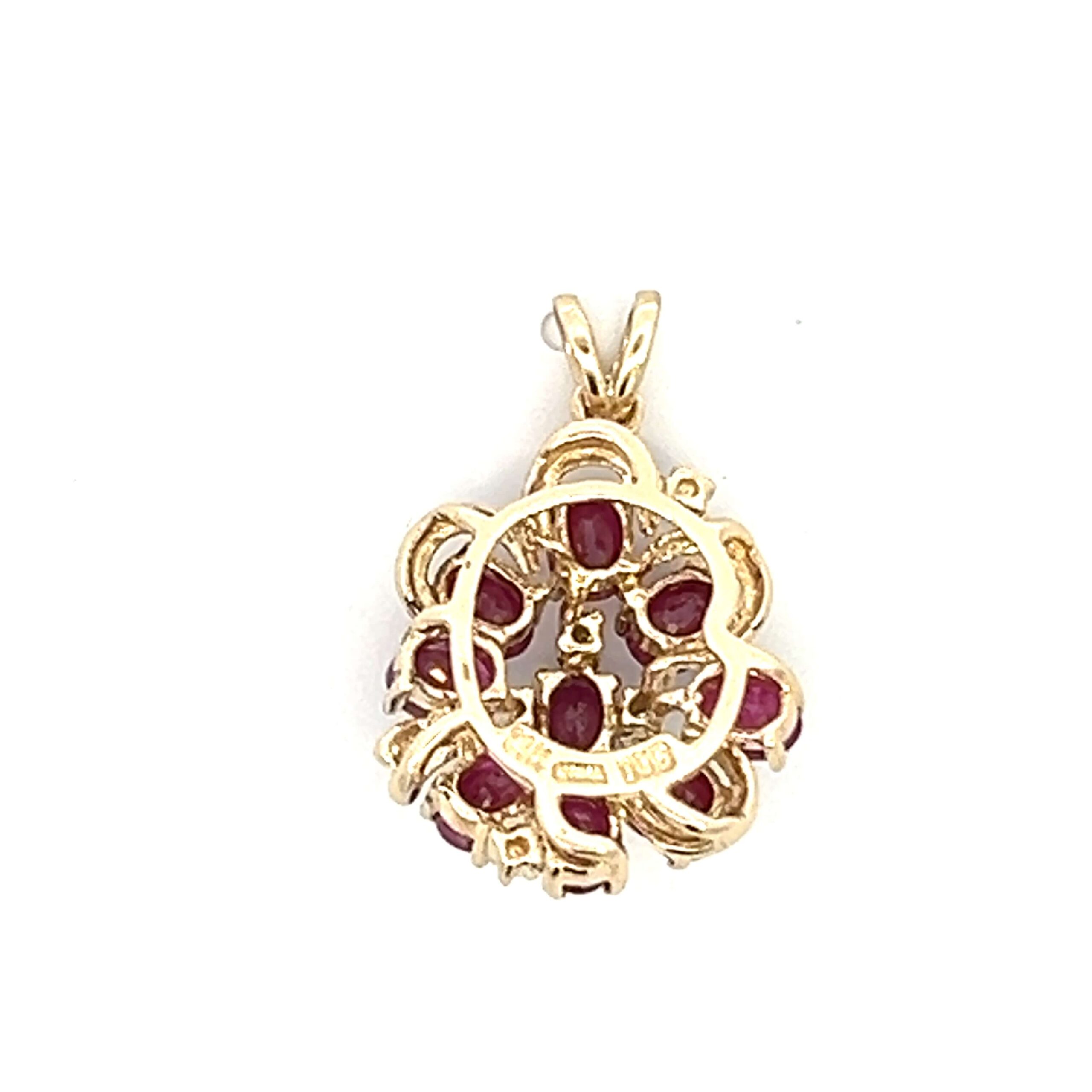 One estate 14 karat yellow gold cluster pendant set with 9 oval faceted rubies and 6 round brilliant diamond accents