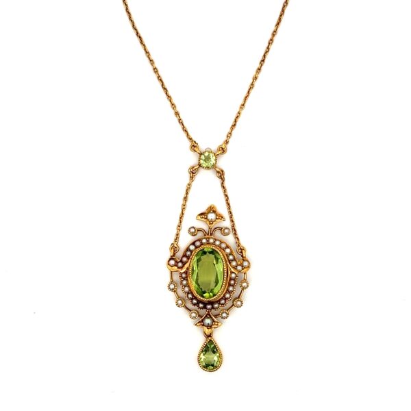 One estate antique 14 karat yellow gold drop pendant necklace with 3 peridots and 38 seed pearls