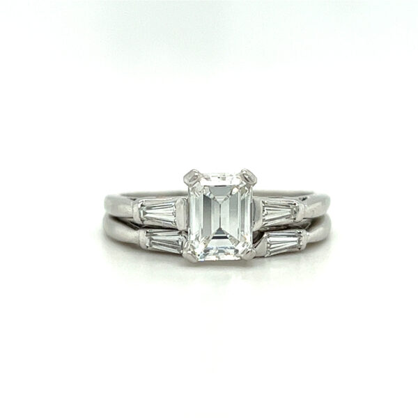 One estate vintage platinum wedding ring set with a center emerald-cut diamond and tapered baguette accent diamonds