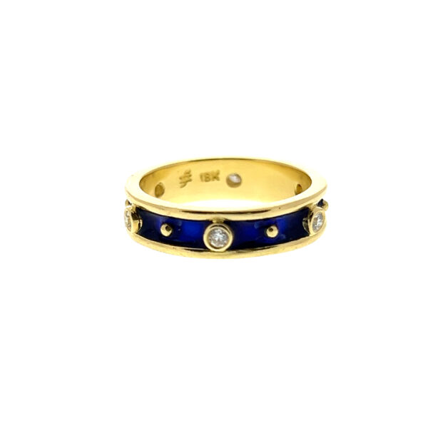 One estate 18 karat yellow gold and cobalt blue enamel band stationed with 6 round diamonds weighing 0.12 carat total weight in bezel settings