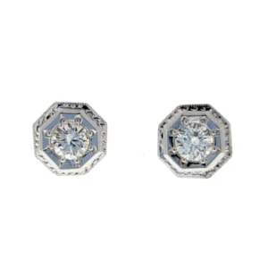 One pair of estate vintage art deco-inspired 14 karat white gold octagon-shaped solitaire stud earrings featuring 2 modern round brilliant-cut diamonds weighing 0.60 carat total weight