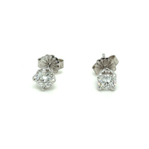 One pair of estate 14 karat white gold solitaire stud earrings with 2 round brilliant diamonds weighing 0.63 carat total weight