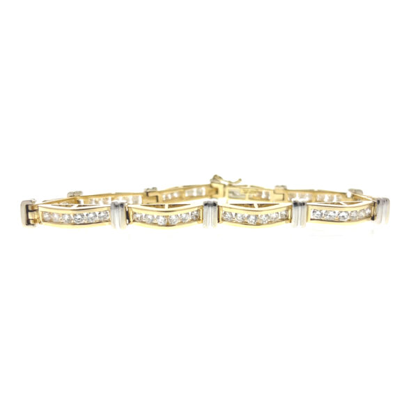 One estate 14 karat two-tone gold wave-design bracelet set with 59 round brilliant diamond weighing 3.09 carats total weight
