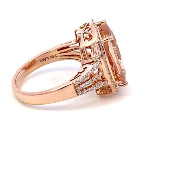 One 14 karat rose gold fashion ring by Lali with a center elongated cushion-cut morganite weighing 6.24 carats with 0.37 carats of round brilliant diamonds set in the halo and the double split-shank band