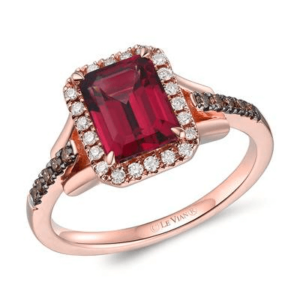One 14 karat rose gold ring by Le Vian with a center emerald-cut rhodolite garnet weighing 1.80 carats surrounded by a halo of 24 round brilliant-cut nude colored diamonds with 10 round brilliant-cut chocolate diamonds in the shoulders of the band in black rhodium-plated settings