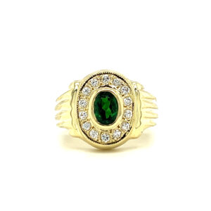 An estate 14 karat green gold ring with an oval green tourmaline and a diamond halo