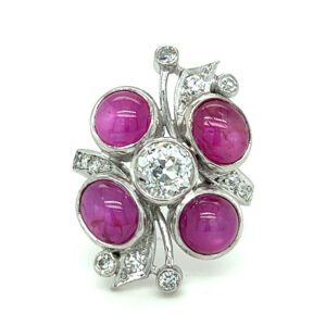 One estate vintage platinum ring with 4 cabochon pink sapphires and and 13 diamonds