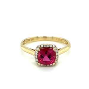 An estate 14 karat yellow gold ring with a cushion pink tourmaline and diamond halo