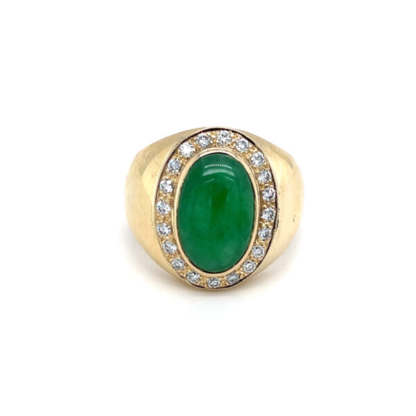 An estate 14 karat yellow gold ring with an oval cabochon apple green jadeite and a halo of 20 round brilliant diamonds