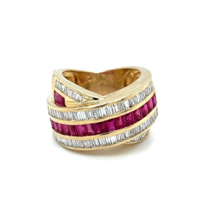 One estate 14 karat yellow gold crossover ring with a center line of lab-created baguette rubies and 2 outer rows of baguette diamonds