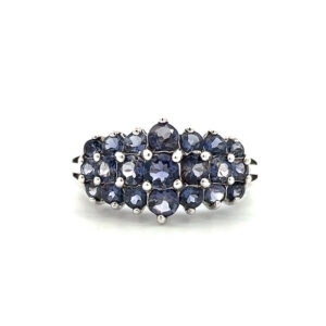 An estate sterling silver three-row cluster band featuring 21 round iolites weighing 2.15 carat total weight