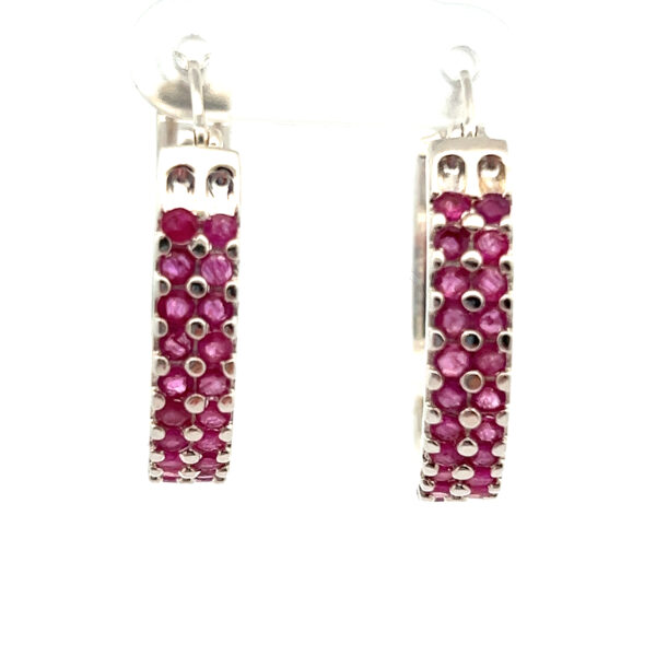One pair of sterling silver hoop earrings with double rows of round-faceted rubies