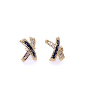 A pair of estate 14 karat yellow gold X-design stud earrings featuring round blue sapphires and round diamonds in channel settings