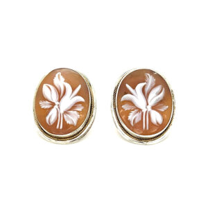 An estate pair of sterling silver and 10 karat yellow gold oval shell cameo earrings with lily flower images