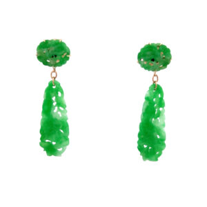An estate vintage pair of 14 karat yellow gold drop earrings features carved oval jadeite and pear-shaped carved jadeite