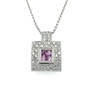 One estate 18 karat white gold pendant necklace with 4 square-cut pink sapphires and 48 round brilliant accent diamonds on an 18" long white gold wheat chain