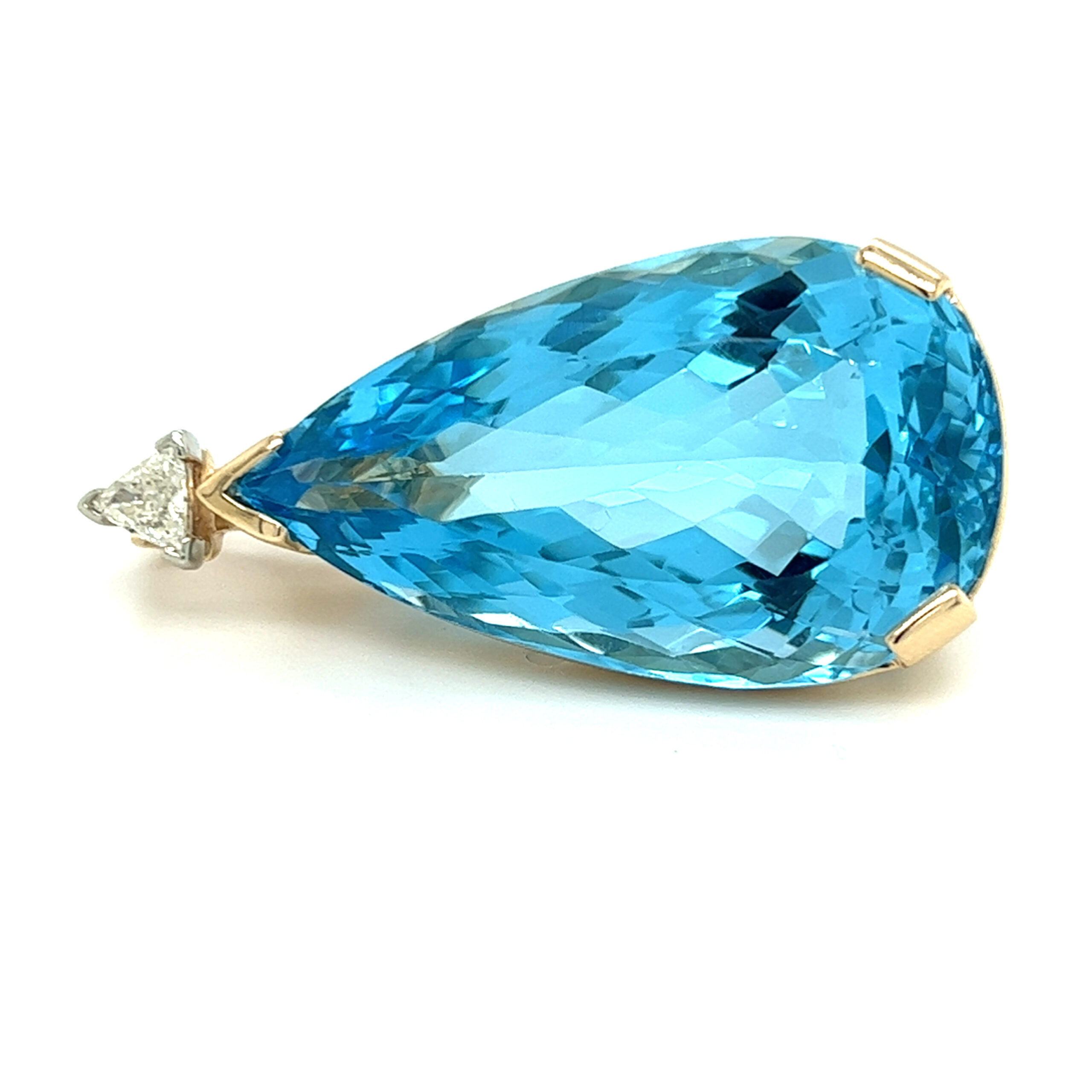 An estate 14 karat gold enhancer pendant with a 33.75x12.7mm pear-shaped blue topaz