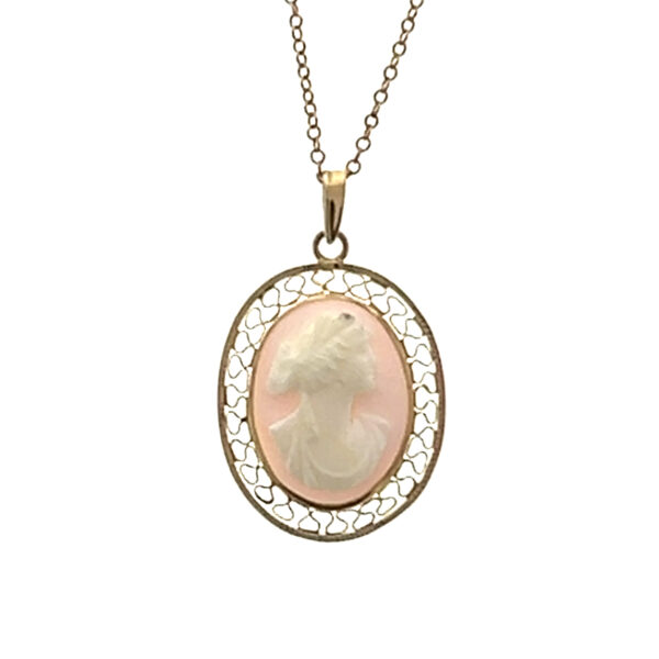 One estate vintage 10 karat yellow pendant necklace featuring an oval pendant with a pink conch shell cameo