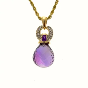 One estate 14 karat yellow gold pendant necklace with a briolette amethyst and an accent tapered baguette amethyst and 18 round brilliant accent diamonds