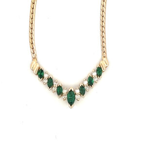An estate vintage 14 karat yellow gold chevron bar necklace with marquise emerald and diamonds