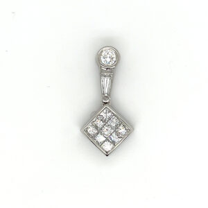 An estate platinum drop pendant set with diamonds in a variety of shapes