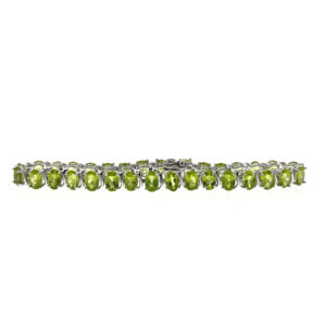 One estate sterling silver gemstone line bracelet with 32 oval-faceted peridot and S-shaped accent links