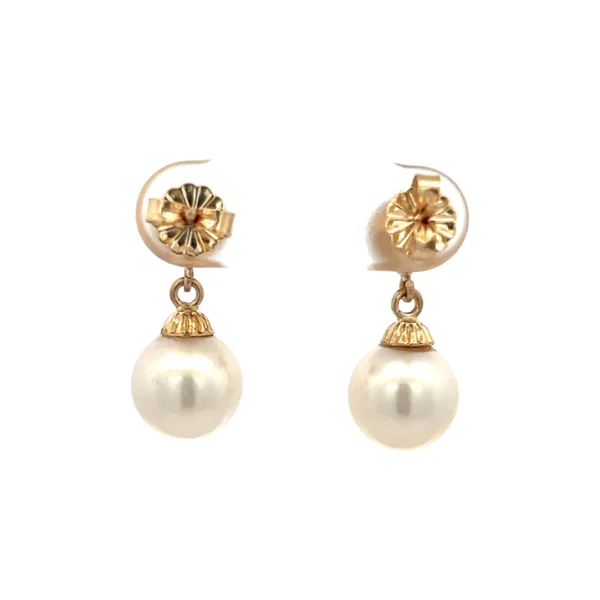 A pair of 14 karat yellow gold estate vintage pearl drop earrings