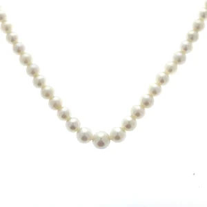 An estate vintage pearl strand necklace featuring freshwater pearls in graduated sizes with a white gold clasp