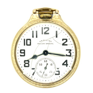 An estate open face vintage pocket watch with a yellow gold-tone case, white dial, two-hand movement, and bold Arabic hour numerals