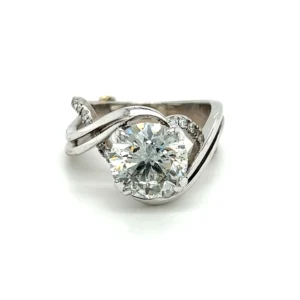estate 14 karat white gold Enchantment engagement ring by Mark Schneider with a center 3.02 carats round brilliant diamond and 0.26 carats of round brilliant accent diamonds.