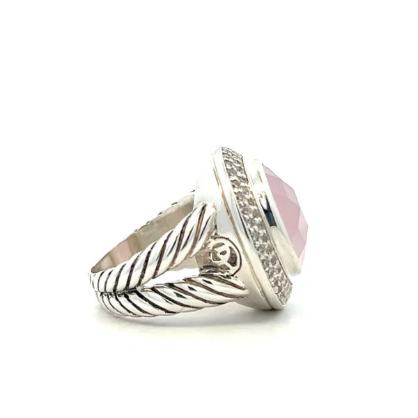 One (1) estate sterling silver twin shank cable design ring signed David Yurman set with one (1) 13.5mm round pink quartz with checkerboard facet and sixty-nine (69) round brilliant diamonds approximately 0.25 total carat weight and matching H color and SI clarity.