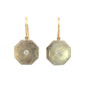 One estate pair of platinum and 14 karat diamond solitaire drop earrings featuring 2 old European-cut diamonds weighing 0.10 carat total weight set in octagon-shaped platinum discs with textured designs and 14 karat yellow gold shepherd hook wires