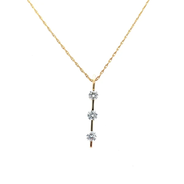 One (1) 14 karat yellow gold bar design pendant set with three (3) round brilliant diamonds approximately 1.00 total carat weight with matching I/J color and SI/I1 clarity. The pendant is suspended on one (1) 14 karat yellow gold 19" rope chain.