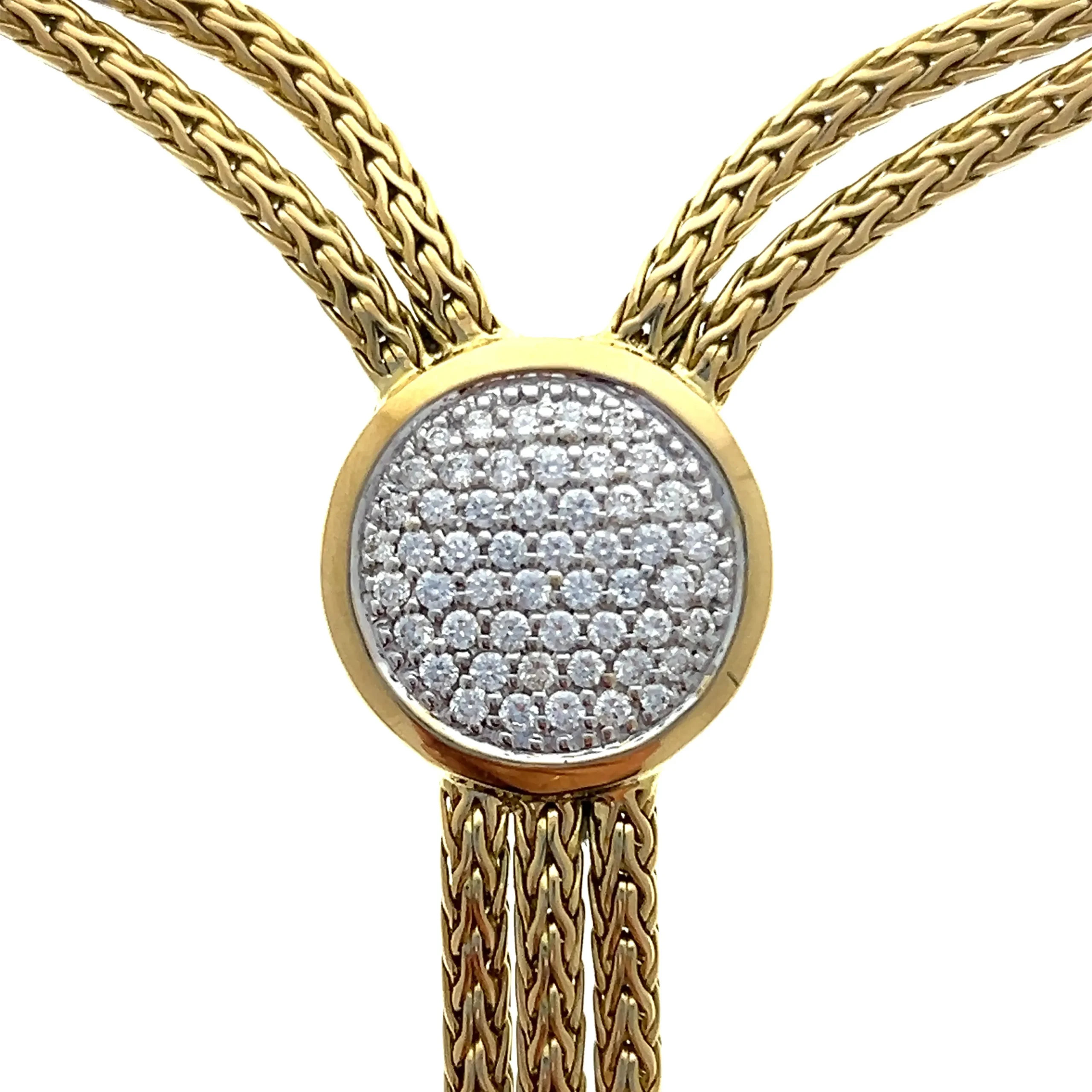 One estate 18 karat yellow gold John Hardy Y-design necklace with a braided chain design. The main part of the necklace features twin braided chain that meet at a round yellow gold pendant set with 52 round brilliant cut diamonds weighing 0.25 total carat weight in white gold pave settings. Three braided chains drop down to a round yellow gold pendant with a hammered texture, with twin braided chains dropping from this pendant to a smaller round yellow gold pendant with a hammered texture, with a single braided chain dropping from this pendant. The necklace measures 17" long. Secured with a lobster claw clasp. Designed by John Hardy.