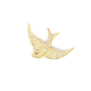 estate 18 karat yellow gold flying bird brooch set with 173 round brilliant diamonds approximately 1.50 total carat weight and 1 round 1mm ruby set at the bird's eye.