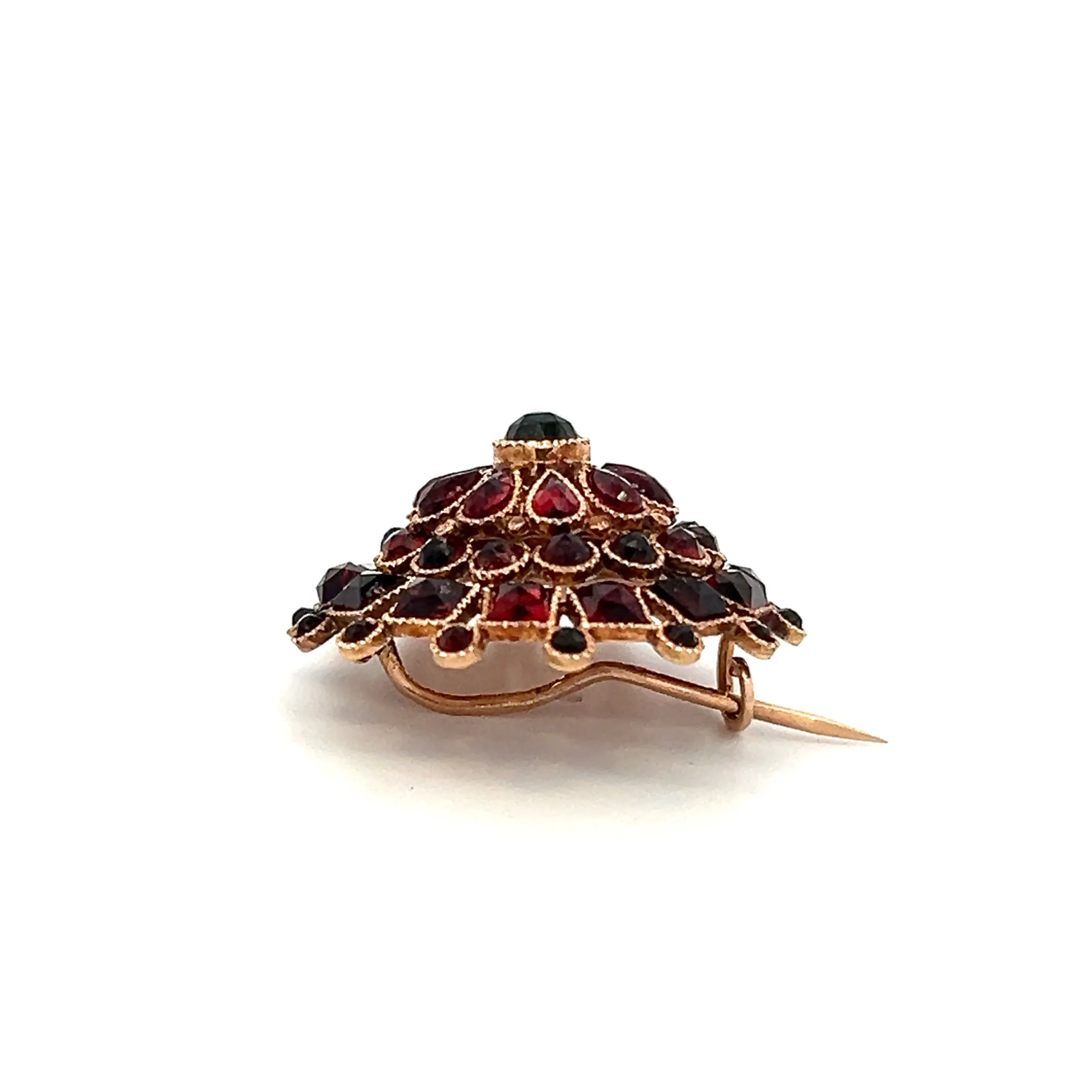 One sterling silver and vermeil cluster-style sunburst brooch with 53 faceted garnets in round, pear, and square shapes in a sunburst design. Each garnet is in a delicate rope bezel setting.