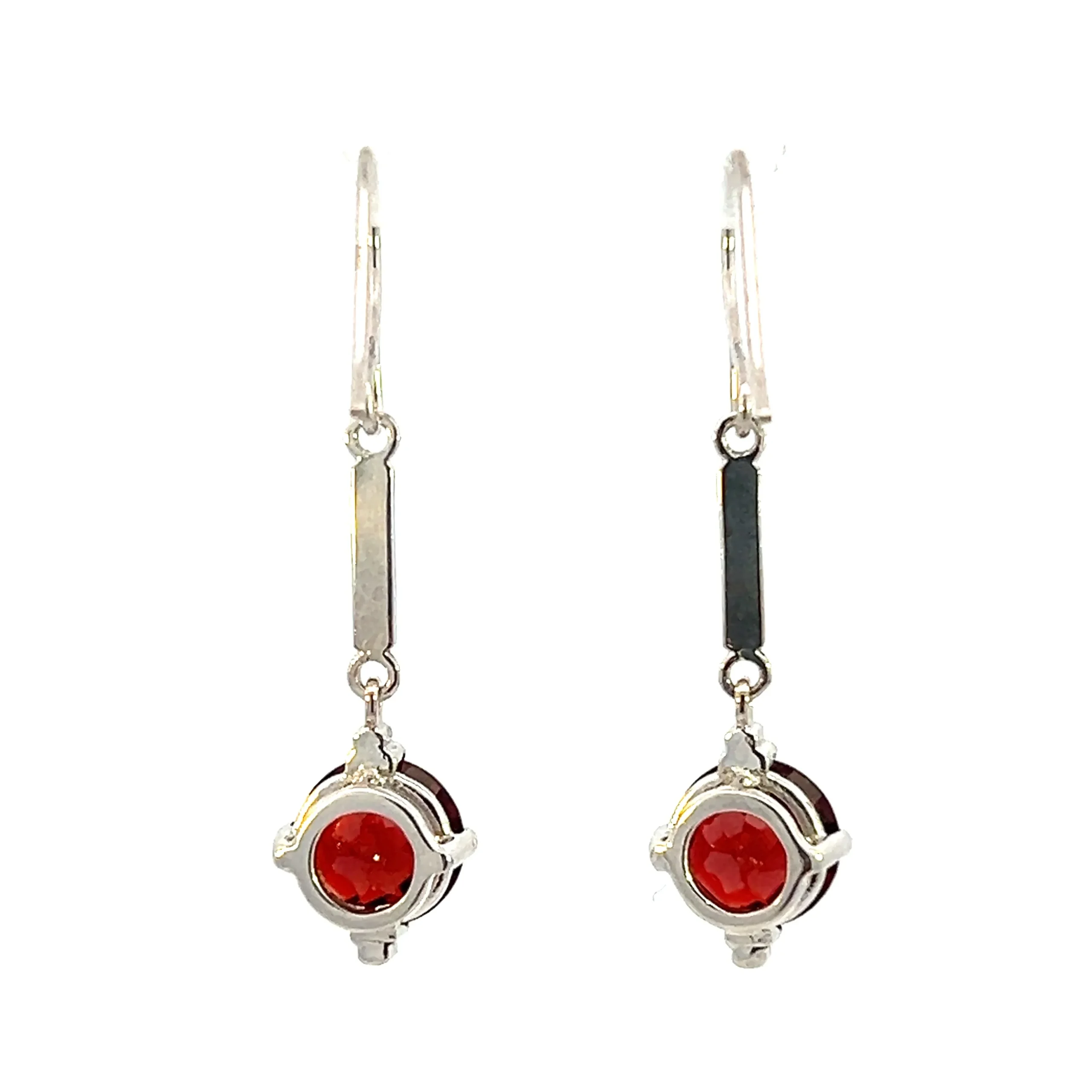 One estate pair of 14 karat white gold drop earrings with each earring featuring a thin polished silver bar accent that drops to an 8mm round checkerboard-faceted garnet in a four-prong setting