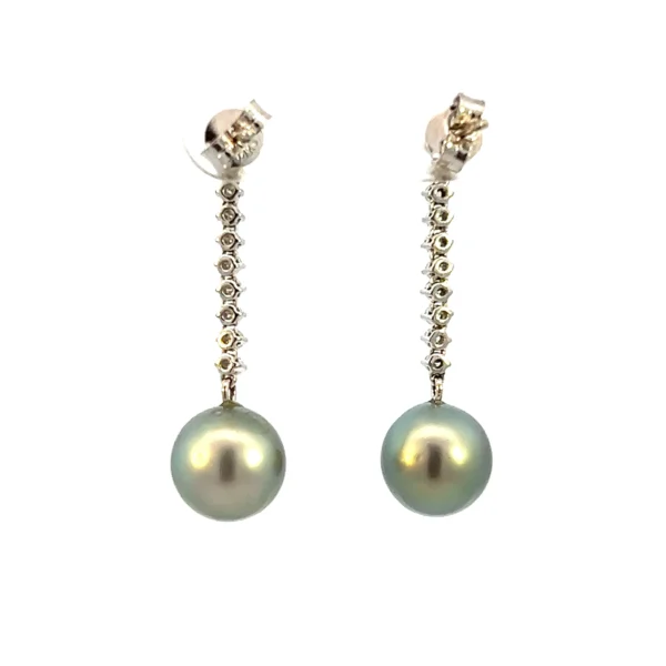 One pair of estate 14 karat white gold drop earrings containing round brilliant accent diamonds that drop in a line to a 9.2mm round cultured Tahitian pearl.