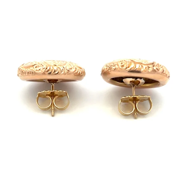 One pair of estate 14 karat rose gold button stud earrings from the 1930s featuring hand-engraved flower designs.