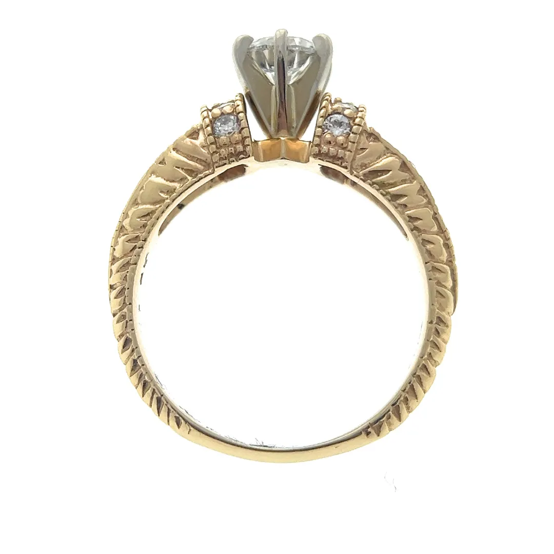 One 14 karat yellow gold vintage-inspired engagement ring with a center round brilliant diamond weighing 0.70 carats in a white gold six-prong setting with 20 round brilliant accent diamonds in the band with etched designs