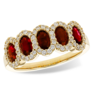 A 14 karat yellow gold five-stone ring with 5 oval faceted rubies each surrounded by a halo of diamonds that overlap slightly with each other