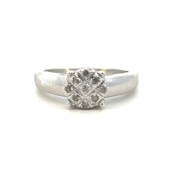 Estate sterling silver diamond cluster disc ring with 9 round brilliant-cut diamonds in bead settings.