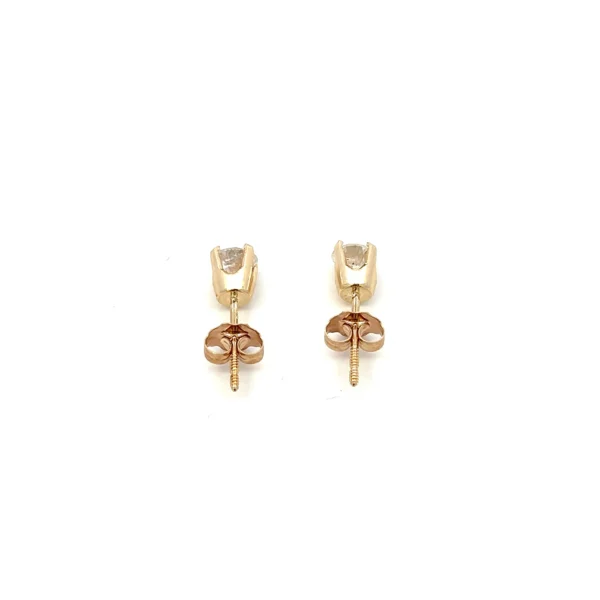 One 14 karat yellow gold pair of estate round diamond stud earrings containing 2 round brilliant diamonds weighing 0.40 carat total weight in four-prong settings.