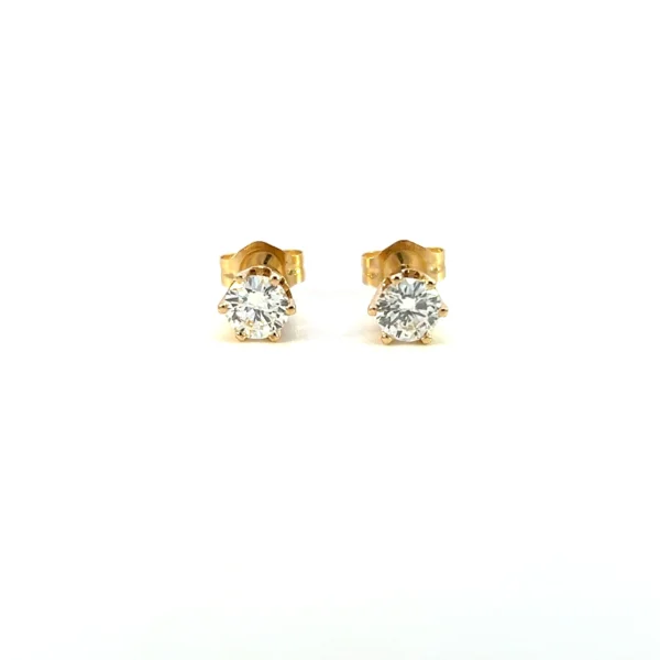 One pair of estate vintage diamond stud earrings crafted from yellow gold featuring 2 round brilliant-cut diamonds weighing 0.50 carat total weight in six-prong settings
