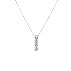 One estate three-stone diamond drop necklace crafted from 14 karat white gold containing a rectangle-shaped drop pendant set with 3 round brilliant diamonds weighing 0.47 carat total weight. The pendant is suspended from an 18" white gold box link chain with a spring ring clasp.