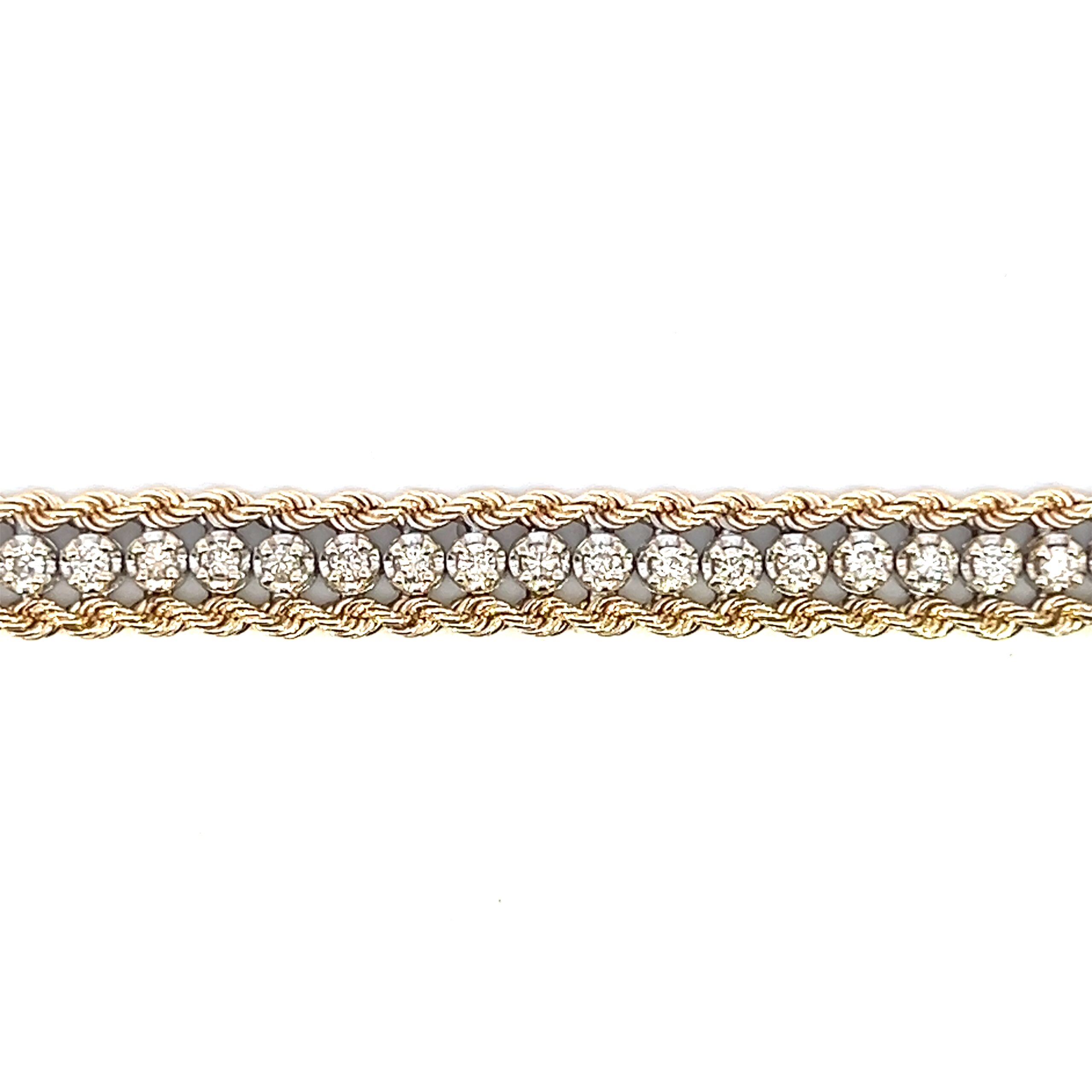 One estate 14 karat yellow gold diamond bracelet from the 1970s featuring 48 round brilliant-cut diamonds weighing 1.50 carat total weight in white gold prong settings with a yellow gold rope chain on either side of the diamonds. The bracelet measures 7.25" long and is secured with a box clasp and safety catch.