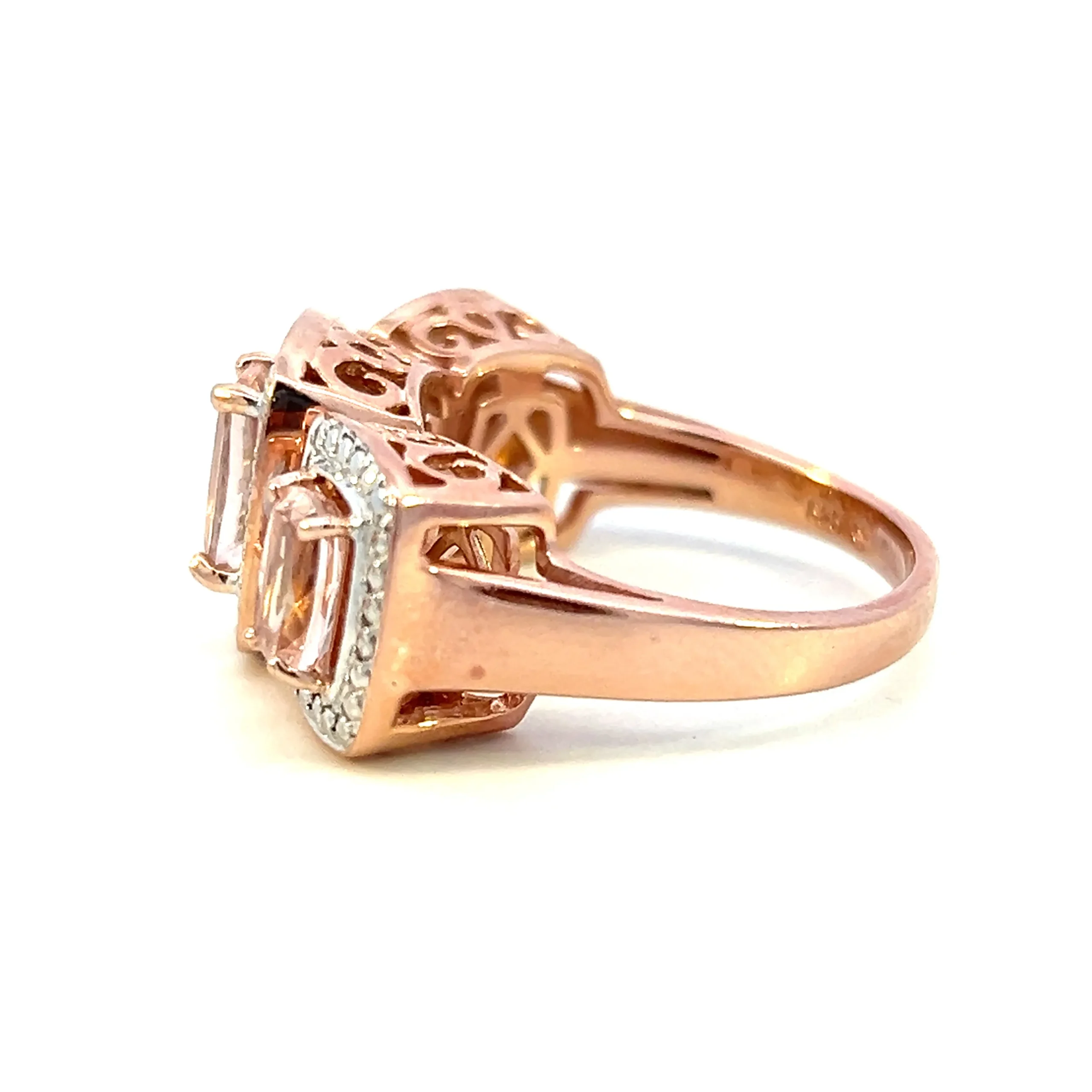 One estate rose gold vermeil three-stone ring containing 3 cushion-cut morganite each surrounded by a sterling silver beadwork halo